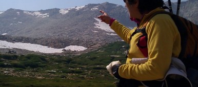 Brenda Avadian pointing toward Mt. Langley