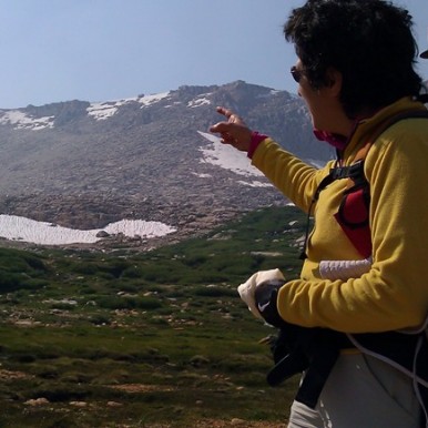 Brenda Avadian pointing toward Mt. Langley