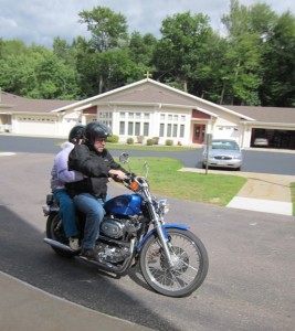 Bell Tower Bucket List- Gerry MacSwain-Butkiewicz riding a motorcycle