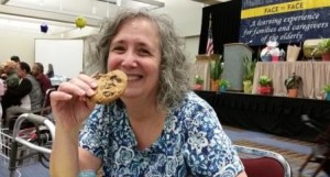 Susan Kraker enjoying a cookie at Face to Face - Web