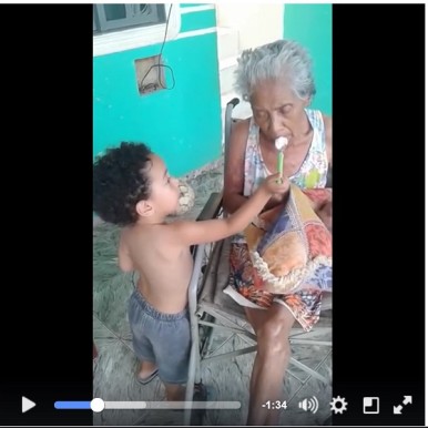 Caregiver Inspiration - Little boy lovingly feeding his elder