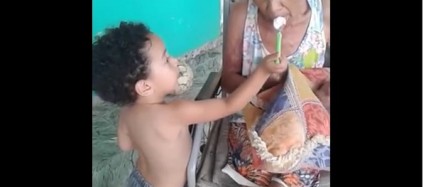 Caregiver Inspiration - Little boy lovingly feeding his elder