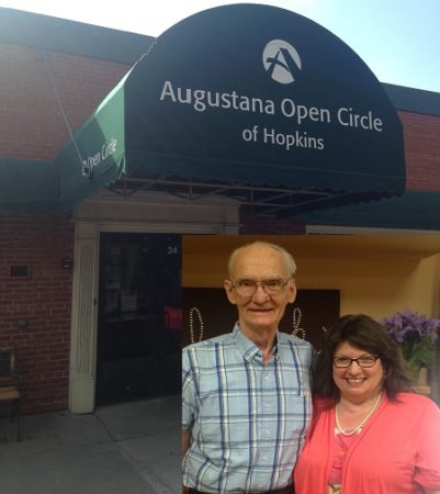 Sheri Zschocher and her husband Bob in front of the Augustana Open Circle Adult Day Services
