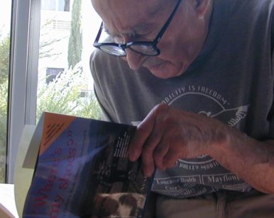 Martin Avadian looks through Alzheimer's book about him