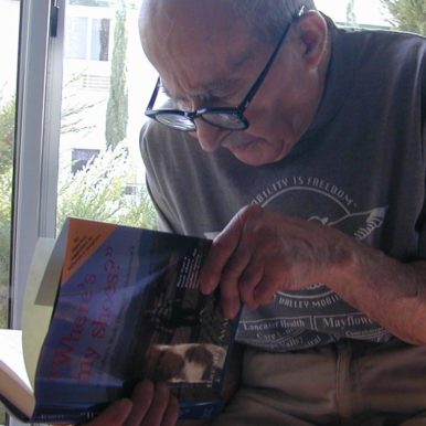 Martin Avadian looks through Alzheimer's book about him
