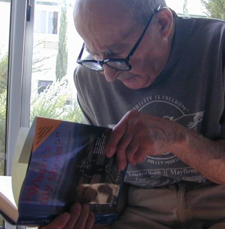 Martin Avadian looks through the first edition Alzheimer's book about him
