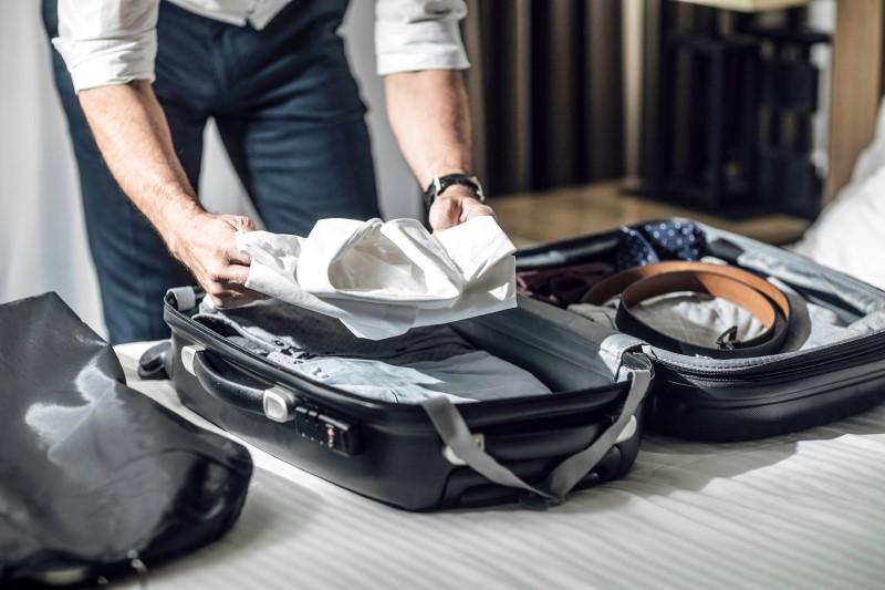 Do not place your luggage on the bed - Shutterstock image used from Afar.com article