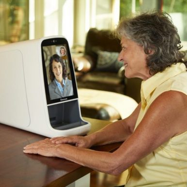 Woman using Omcare device