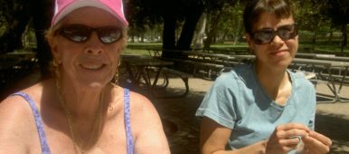 Caregiver companion w elder picnic table eating pistachios Tori Tellem inspiration