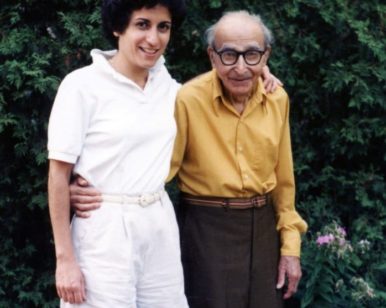 Brenda Avadian standing with her father Martin Avadian under his apple tree