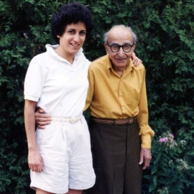 Brenda Avadian standing with her father Martin Avadian under his apple tree