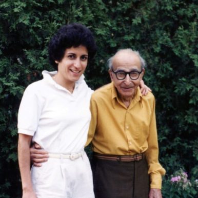 Brenda Avadian with her father, Martin Avadian, standing under his apple tree