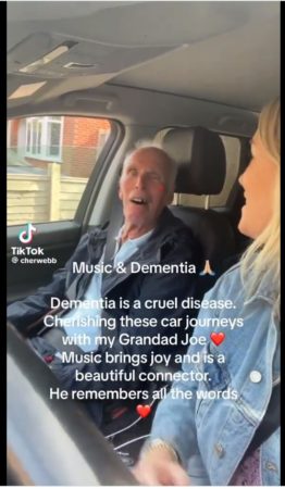 Jonathan Slater shares CherWebb's TikTok video singing John Denver's hit while on a car ride with her granddad with dementia