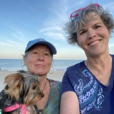 Carol-Lindsay-and-sister-Marjorie-holding-dog-at-Carolina-beach-2024