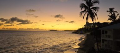 St. Thomas in the Virgin Islands beach view with palm trees at sunset