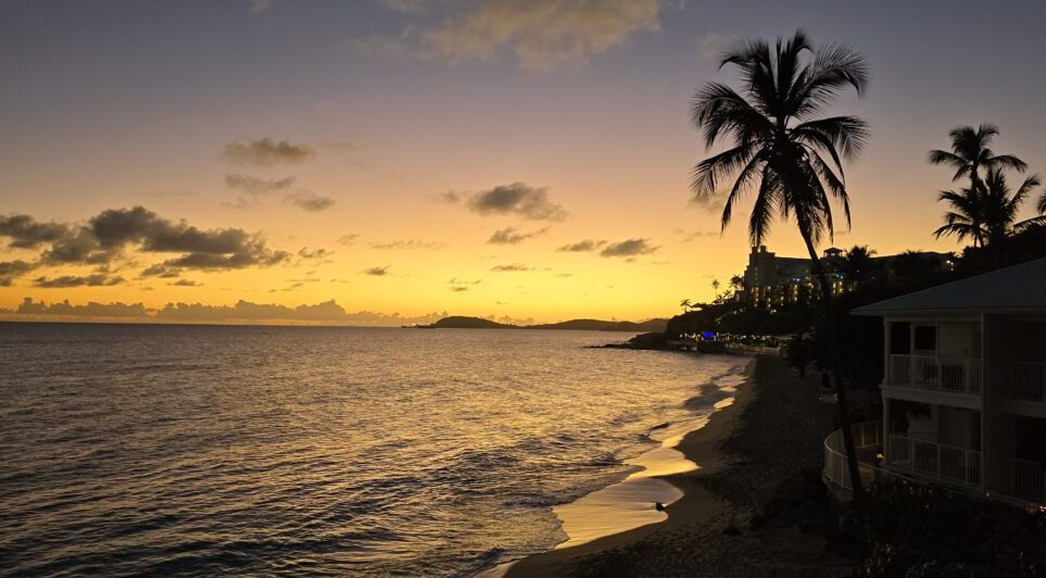 St. Thomas in the Virgin Islands beach view with palm trees at sunset St. Thomas in the Virgin Islands beach view with palm trees at sunset